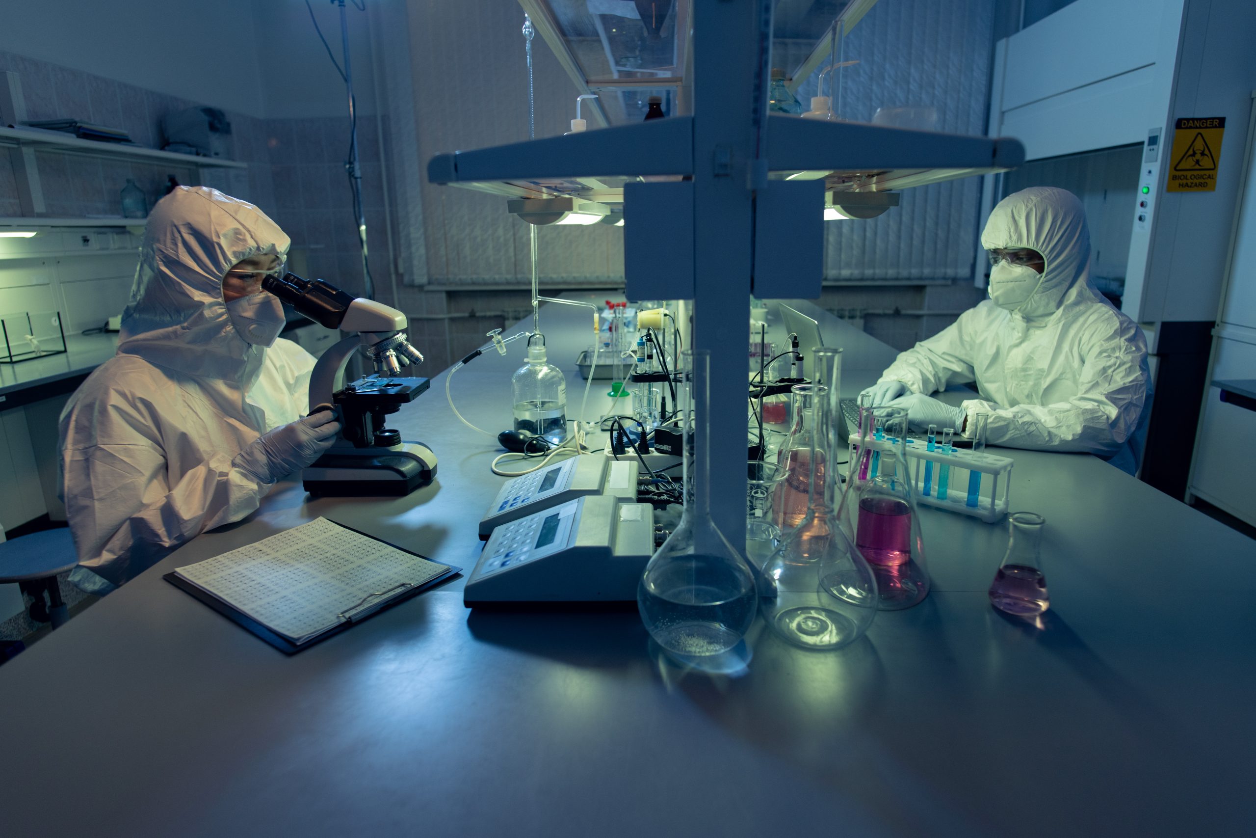 Chemists working with chemical samples